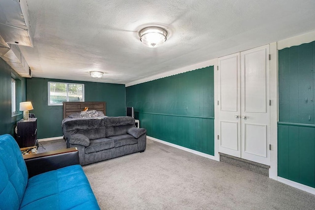 795 Brixham Rd, Columbus, OH 43204 - bedroom with carpet floors, a textured ceiling, baseboards, and wooden walls