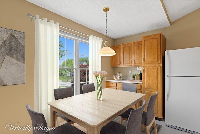 1275 Shelby Cir, Reynoldsburg, OH 43068 - dining space featuring a textured ceiling