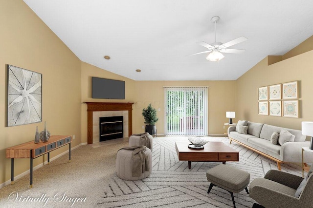 1275 Shelby Cir, Reynoldsburg, OH 43068 - carpeted living area with vaulted ceiling, a ceiling fan, baseboards, and a tile fireplace
