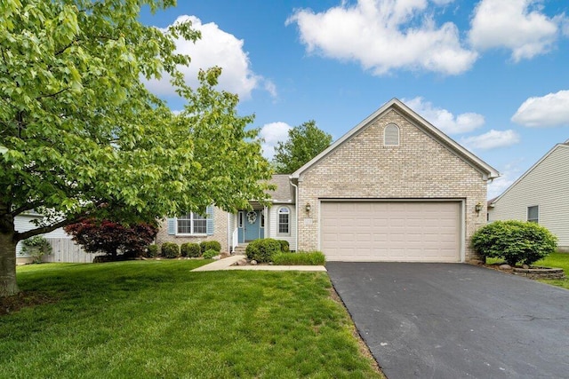 1275 Shelby Cir, Reynoldsburg, OH 43068 - view of front of property with brick siding, a front lawn, asphalt driveway, and a garage