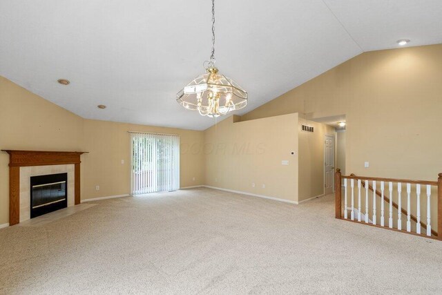 1275 Shelby Cir, Reynoldsburg, OH 43068 - unfurnished living room featuring lofted ceiling, a chandelier, light carpet, a tile fireplace, and baseboards