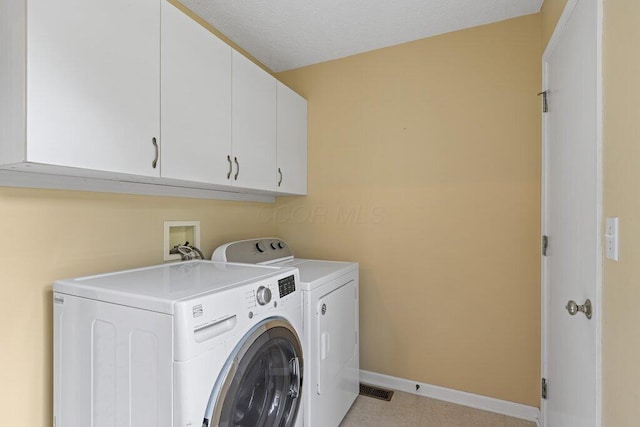 1275 Shelby Cir, Reynoldsburg, OH 43068 - laundry area with cabinet space, independent washer and dryer, and baseboards