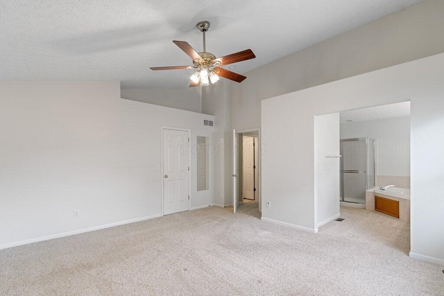 1275 Shelby Cir, Reynoldsburg, OH 43068 - unfurnished bedroom featuring light carpet, baseboards, high vaulted ceiling, connected bathroom, and a ceiling fan