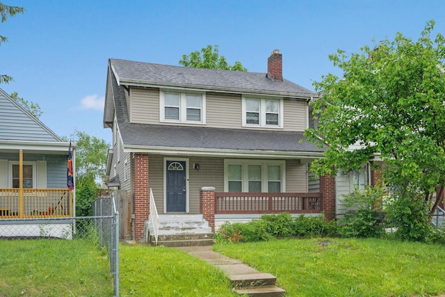 799 E Deshler Ave, Columbus, OH 43206 - view of front of house featuring a porch, a chimney, and roof with shingles