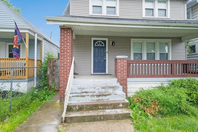 799 E Deshler Ave, Columbus, OH 43206 - property entrance featuring a porch and roof with shingles