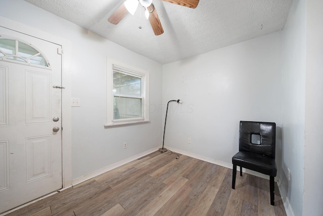 799 E Deshler Ave, Columbus, OH 43206 - unfurnished room featuring wood finished floors, ceiling fan, a textured ceiling, and baseboards