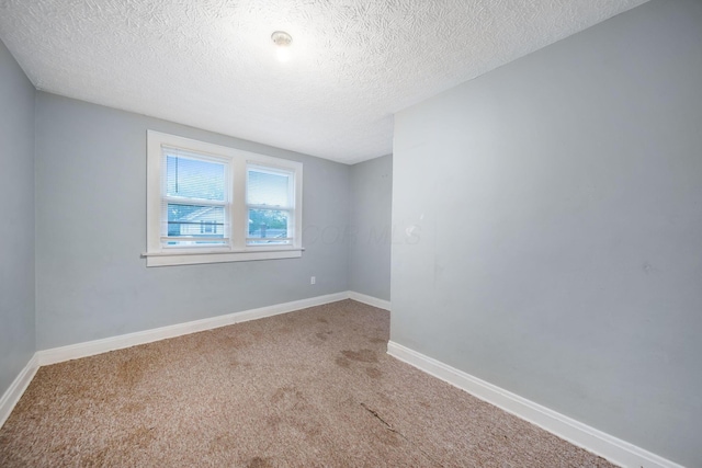799 E Deshler Ave, Columbus, OH 43206 - carpeted empty room with a textured ceiling and baseboards