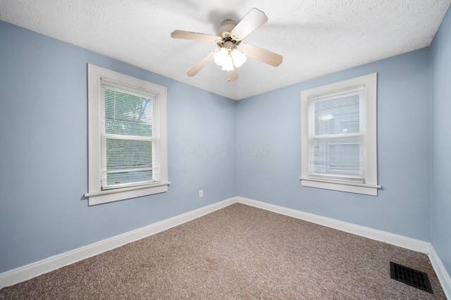 799 E Deshler Ave, Columbus, OH 43206 - spare room with carpet floors, a textured ceiling, baseboards, and ceiling fan