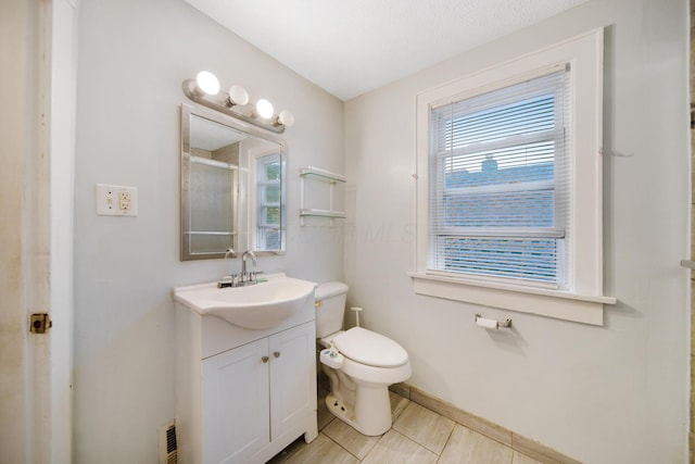 799 E Deshler Ave, Columbus, OH 43206 - bathroom with vanity, toilet, a shower with door, baseboards, and tile patterned floors