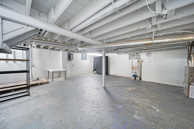 799 E Deshler Ave, Columbus, OH 43206 - unfinished basement with electric panel, water heater, and concrete block wall