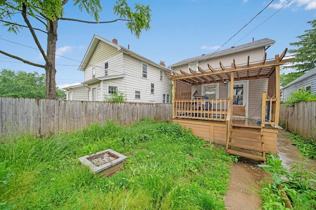 799 E Deshler Ave, Columbus, OH 43206 - back of property with a wooden deck, a pergola, and a fenced backyard