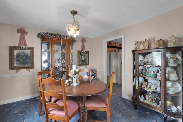 1236 8th Ave, Lancaster, OH 43130 - dining space featuring a chandelier and carpet flooring