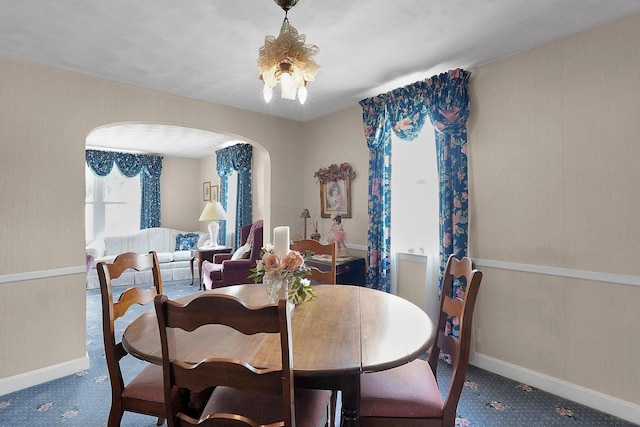 1236 8th Ave, Lancaster, OH 43130 - dining area with arched walkways, carpet, and baseboards