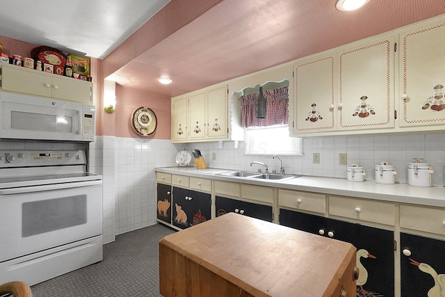 1236 8th Ave, Lancaster, OH 43130 - kitchen with white appliances, light countertops, a sink, tasteful backsplash, and tile walls