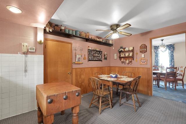 1236 8th Ave, Lancaster, OH 43130 - dining space with wainscoting, carpet floors, ceiling fan, and wooden walls