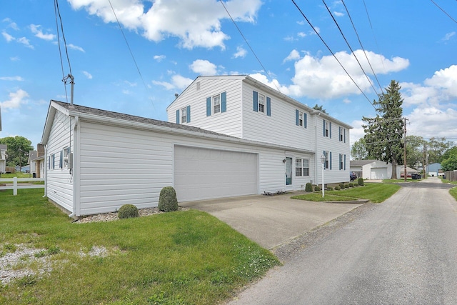 1236 8th Ave, Lancaster, OH 43130 - view of front of home featuring a garage, a front yard, and concrete driveway
