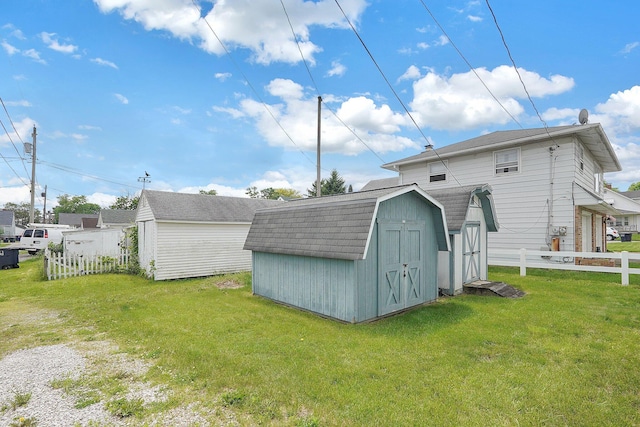 1236 8th Ave, Lancaster, OH 43130 - rear view of house featuring a storage shed, an outdoor structure, and roof with shingles