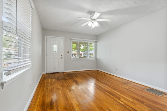 471 Chase Rd, Columbus, OH 43214 - entrance foyer featuring wood finished floors, ceiling fan, baseboards, and a textured ceiling