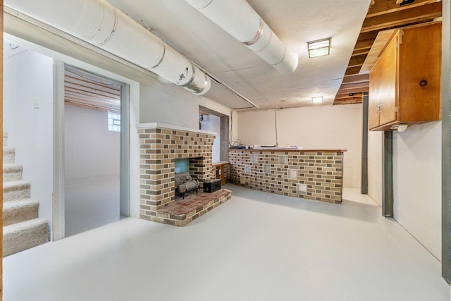 471 Chase Rd, Columbus, OH 43214 - below grade area with a wood stove and stairs