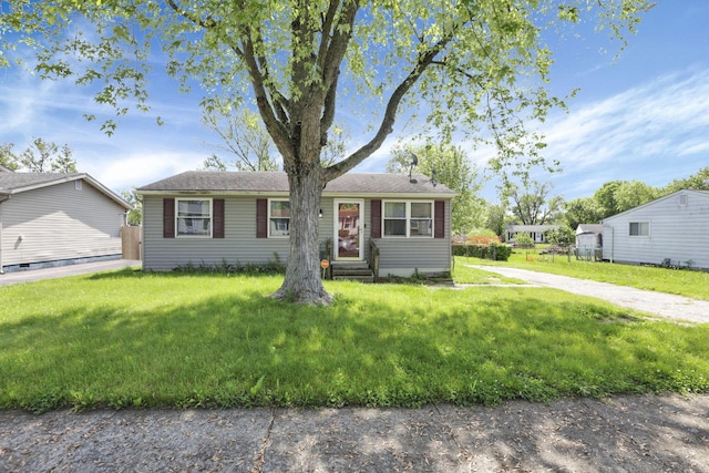 single story home with a front lawn