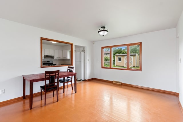 5707 Lindenwood Rd, Columbus, OH 43229 - dining room with baseboards and light wood-type flooring