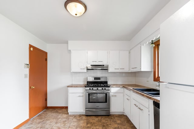 5707 Lindenwood Rd, Columbus, OH 43229 - kitchen with stainless steel appliances, under cabinet range hood, tasteful backsplash, and white cabinetry