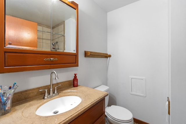 5707 Lindenwood Rd, Columbus, OH 43229 - bathroom featuring vanity, toilet, and a shower