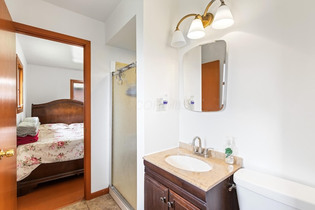 5707 Lindenwood Rd, Columbus, OH 43229 - ensuite bathroom featuring a shower stall, toilet, and vanity