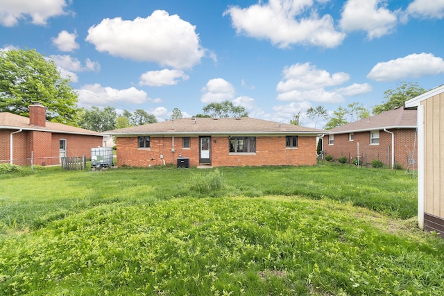 5707 Lindenwood Rd, Columbus, OH 43229 - back of property with brick siding and central AC unit