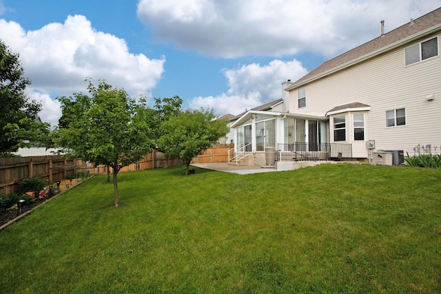 917 Linkfield Dr, Columbus, OH 43085 - view of yard featuring a sunroom, a patio, central AC unit, and entry steps