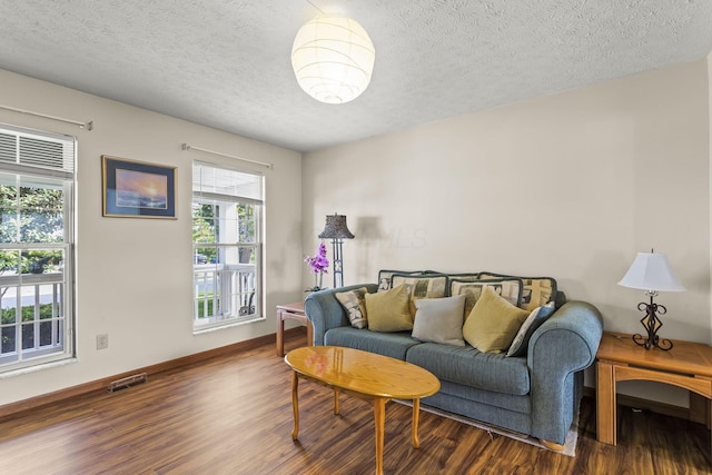 917 Linkfield Dr, Columbus, OH 43085 - living area with wood finished floors, a textured ceiling, and baseboards