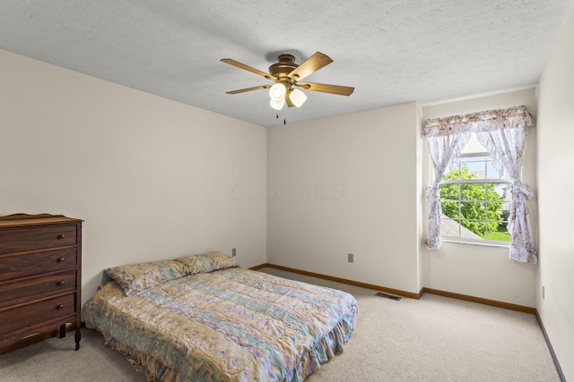 917 Linkfield Dr, Columbus, OH 43085 - bedroom with carpet floors, baseboards, ceiling fan, and a textured ceiling