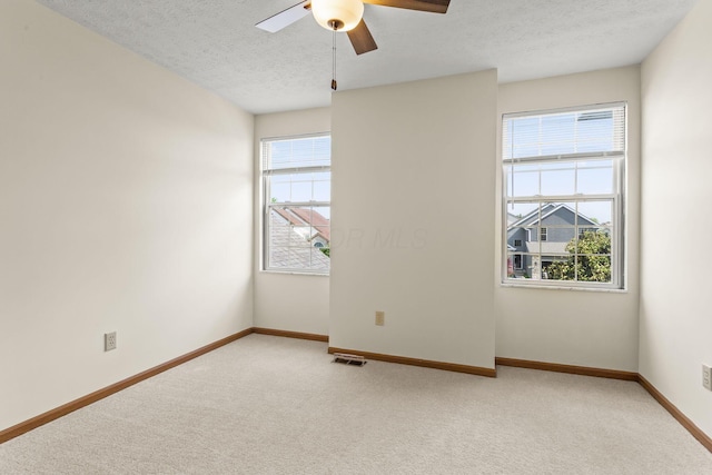 917 Linkfield Dr, Columbus, OH 43085 - unfurnished room with light colored carpet, a textured ceiling, ceiling fan, and baseboards