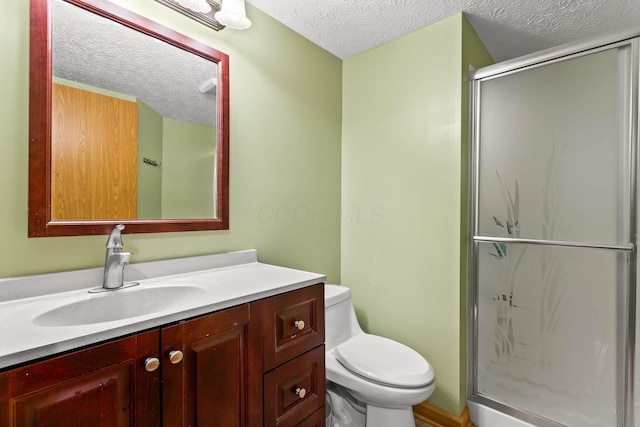 917 Linkfield Dr, Columbus, OH 43085 - bathroom with a textured ceiling, toilet, a stall shower, and vanity