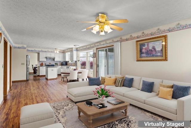 917 Linkfield Dr, Columbus, OH 43085 - living area with a textured ceiling, ceiling fan, and wood finished floors