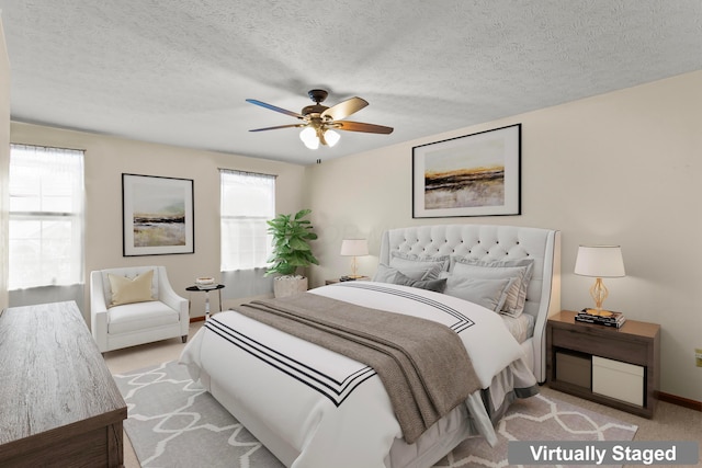 917 Linkfield Dr, Columbus, OH 43085 - carpeted bedroom featuring multiple windows, baseboards, ceiling fan, and a textured ceiling