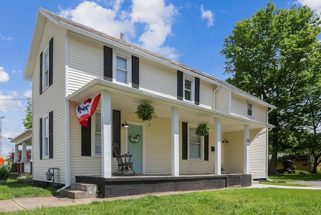 126 S Cherry St, Lancaster, OH 43130 - view of front of house with a porch and a front yard