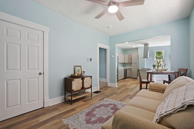 126 S Cherry St, Lancaster, OH 43130 - living area with light wood finished floors, ceiling fan, and baseboards
