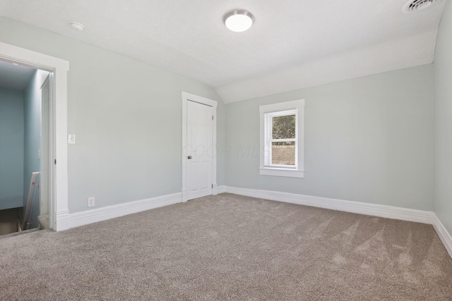 126 S Cherry St, Lancaster, OH 43130 - empty room featuring carpet floors, vaulted ceiling, baseboards, and a smoke detector