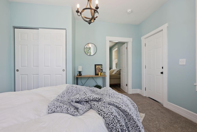 126 S Cherry St, Lancaster, OH 43130 - bedroom with a chandelier, carpet, a closet, and baseboards