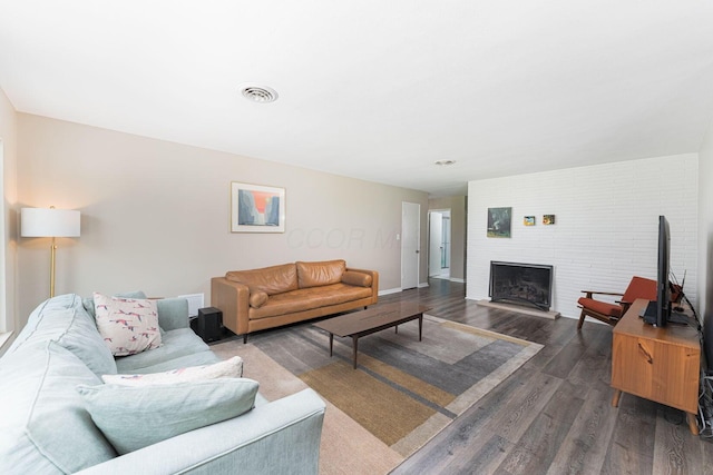 205 Meadowlark Ln, Columbus, OH 43214 - living room with dark wood finished floors, a fireplace, and baseboards