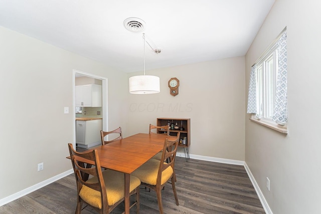 205 Meadowlark Ln, Columbus, OH 43214 - dining area with dark wood-type flooring and baseboards