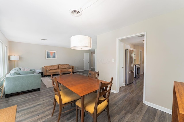 205 Meadowlark Ln, Columbus, OH 43214 - dining area featuring dark wood-style floors and baseboards