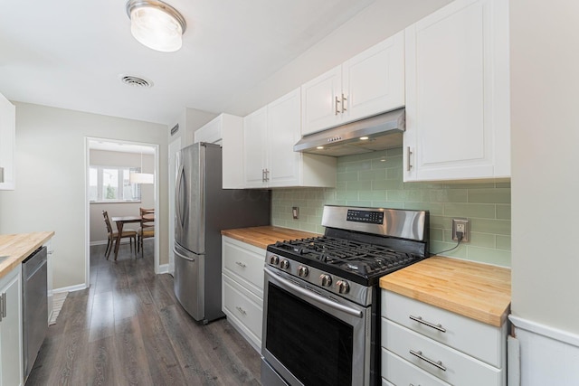205 Meadowlark Ln, Columbus, OH 43214 - kitchen with appliances with stainless steel finishes, under cabinet range hood, and wooden counters