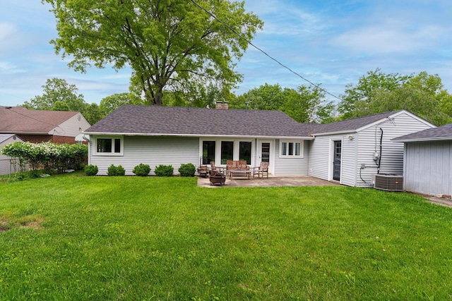 205 Meadowlark Ln, Columbus, OH 43214 - rear view of property with a patio, a yard, a chimney, and central AC