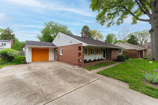 205 Meadowlark Ln, Columbus, OH 43214 - single story home featuring brick siding, an attached garage, driveway, and a chimney