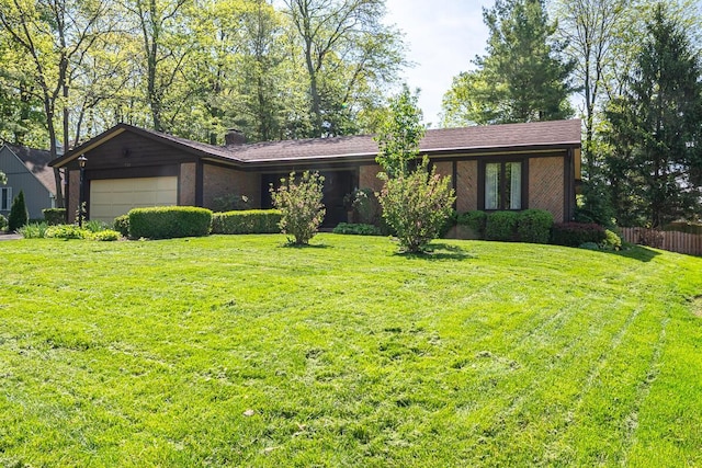 735 Cherrington Rd, Westerville, OH 43081 - view of front facade featuring an attached garage, brick siding, and a chimney
