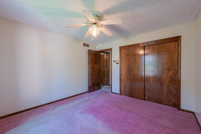 735 Cherrington Rd, Westerville, OH 43081 - unfurnished bedroom with carpet flooring, baseboards, a closet, and a textured ceiling