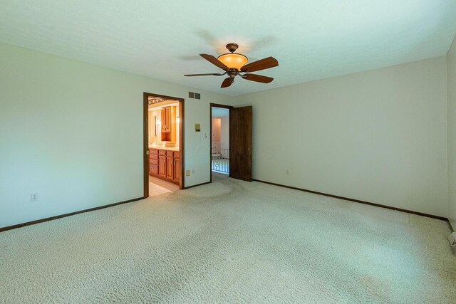 735 Cherrington Rd, Westerville, OH 43081 - unfurnished bedroom featuring light carpet, ensuite bath, baseboards, and a ceiling fan