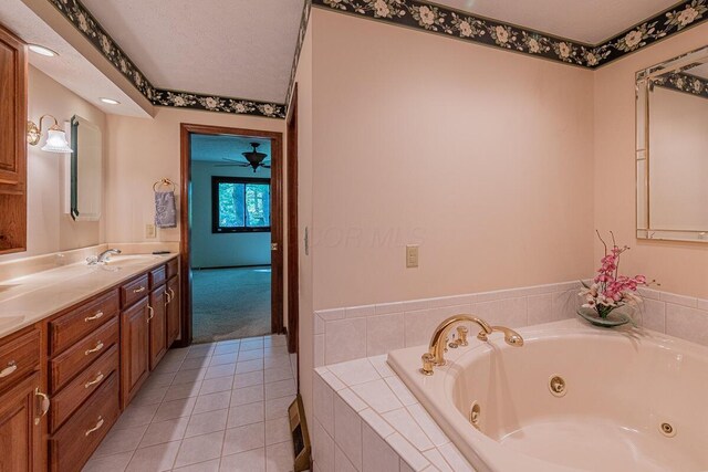 735 Cherrington Rd, Westerville, OH 43081 - bathroom featuring a whirlpool tub, vanity, tile patterned floors, and a ceiling fan
